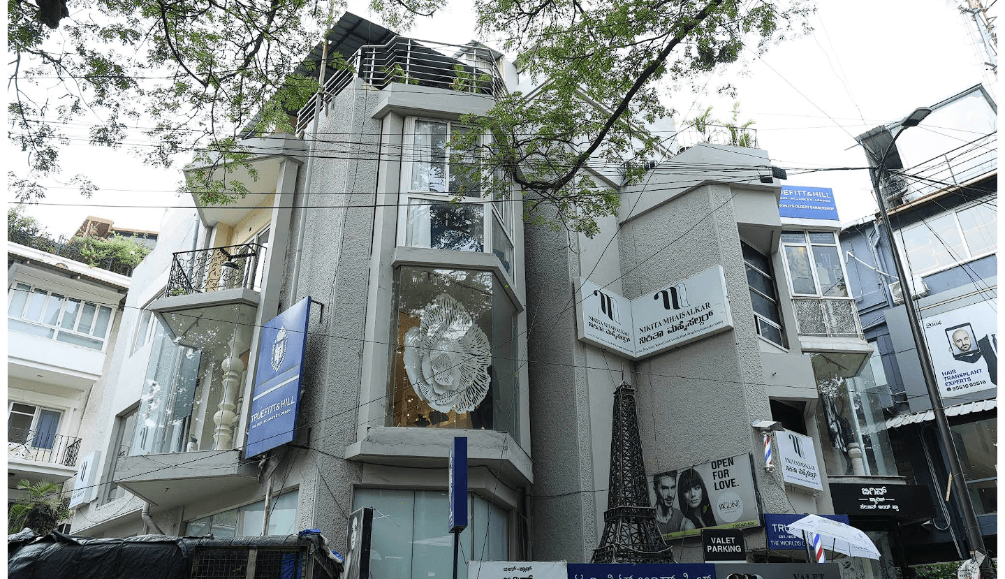 The Arveli atelier on Lavelle Road, Bangalore, its glass frontage set into a stone façade.
